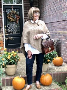 Pamela Lutrell wears cable knit poncho from Goodwill San Antonio
